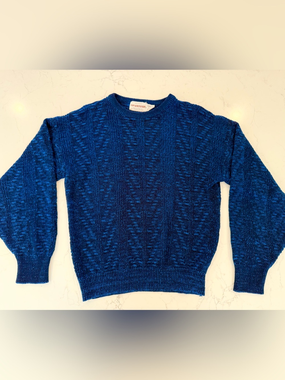 This vintage McGregor blue sweater is made of 100% acrylic